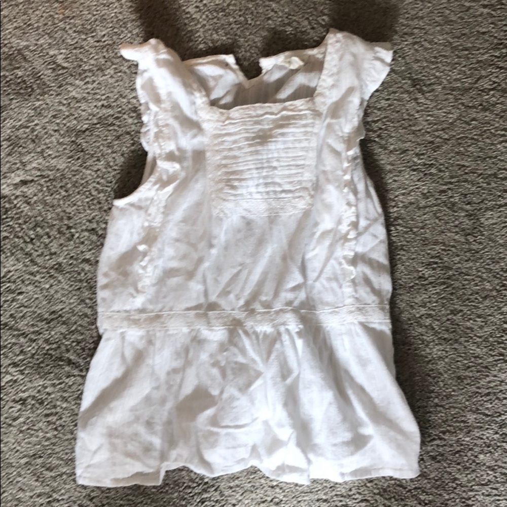 White ruffled tank